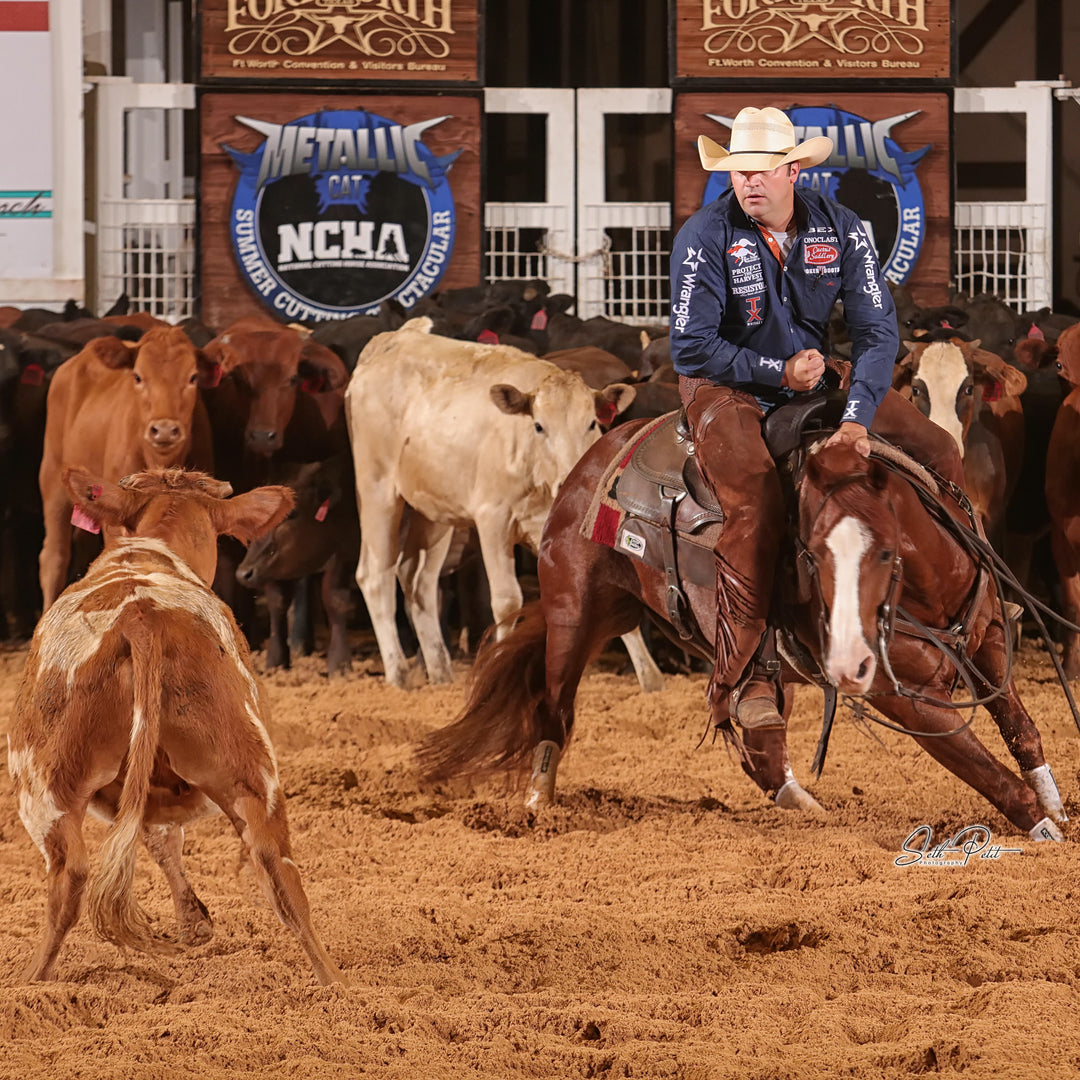 Grant Setnicka on Ristos Fair Cat at the 2020 NCHA Summer Spectacular cutting a cow out of the herd